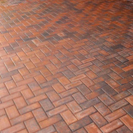 Brick pavers in herringbone pattern.